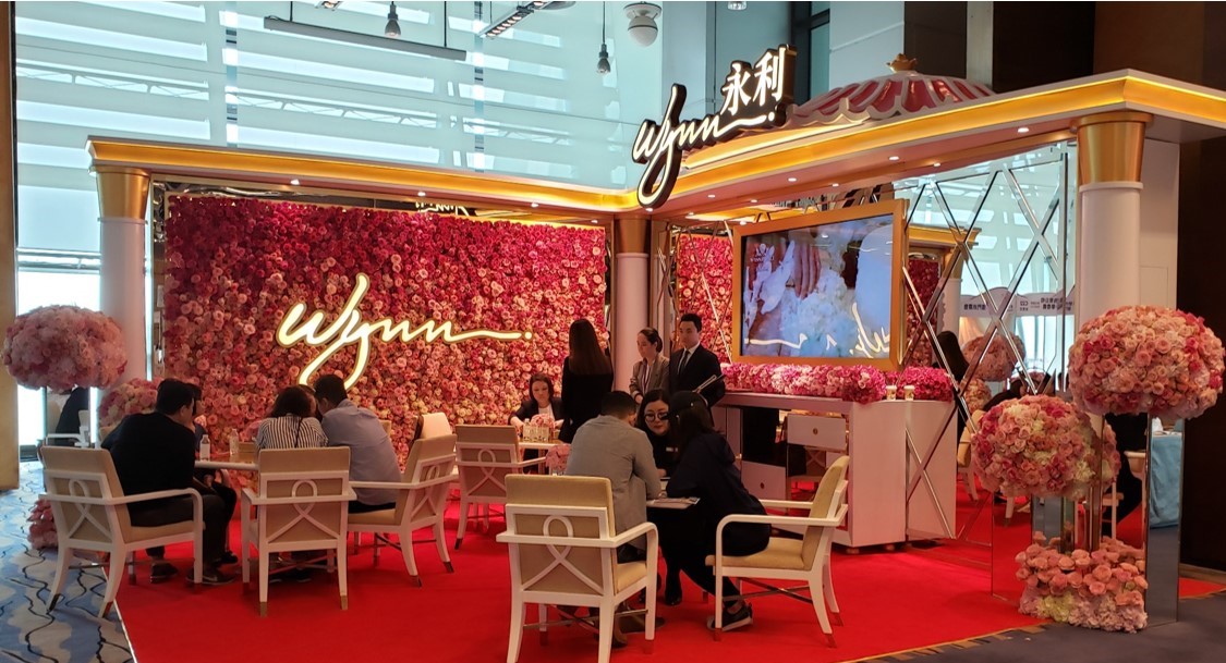 Pink and red flower backdrop at the Wynn booth